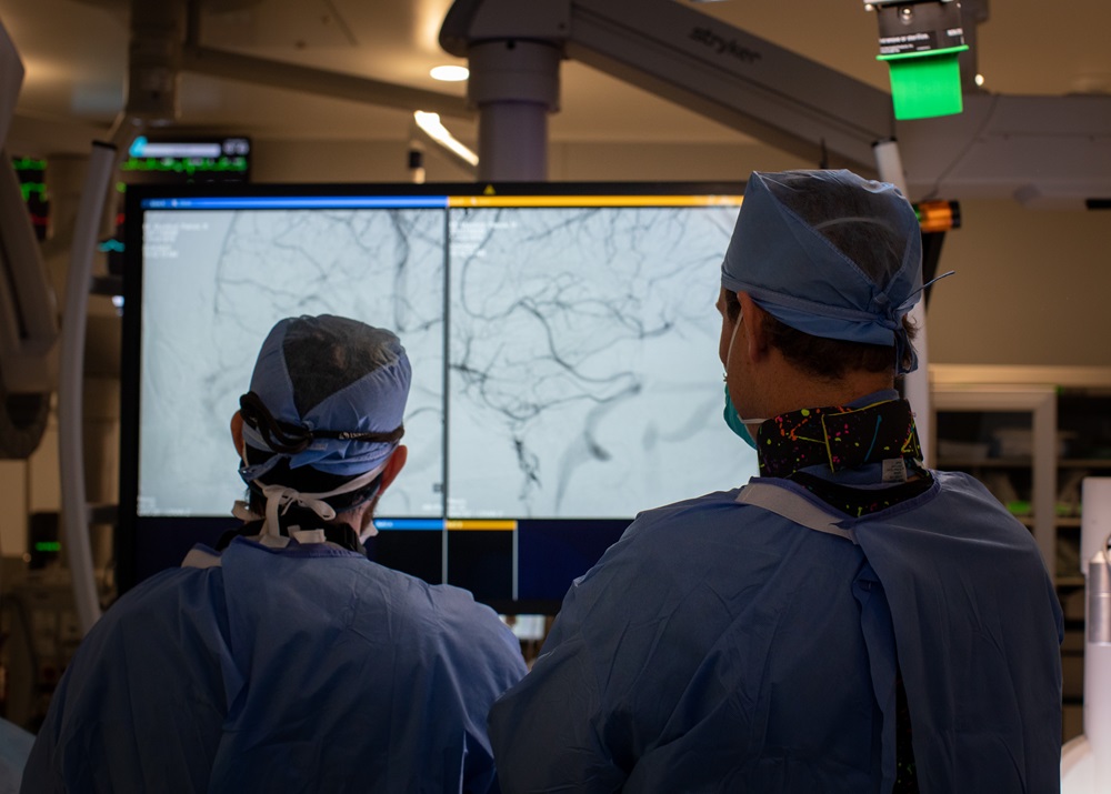 Dr. Burkhardt and a Fellow looking at screen in surgery